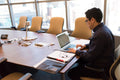 Person using a laptop in a modern office
